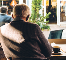 REACH, man sitting in a coffee shop