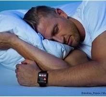 man sleeping with smartwatch