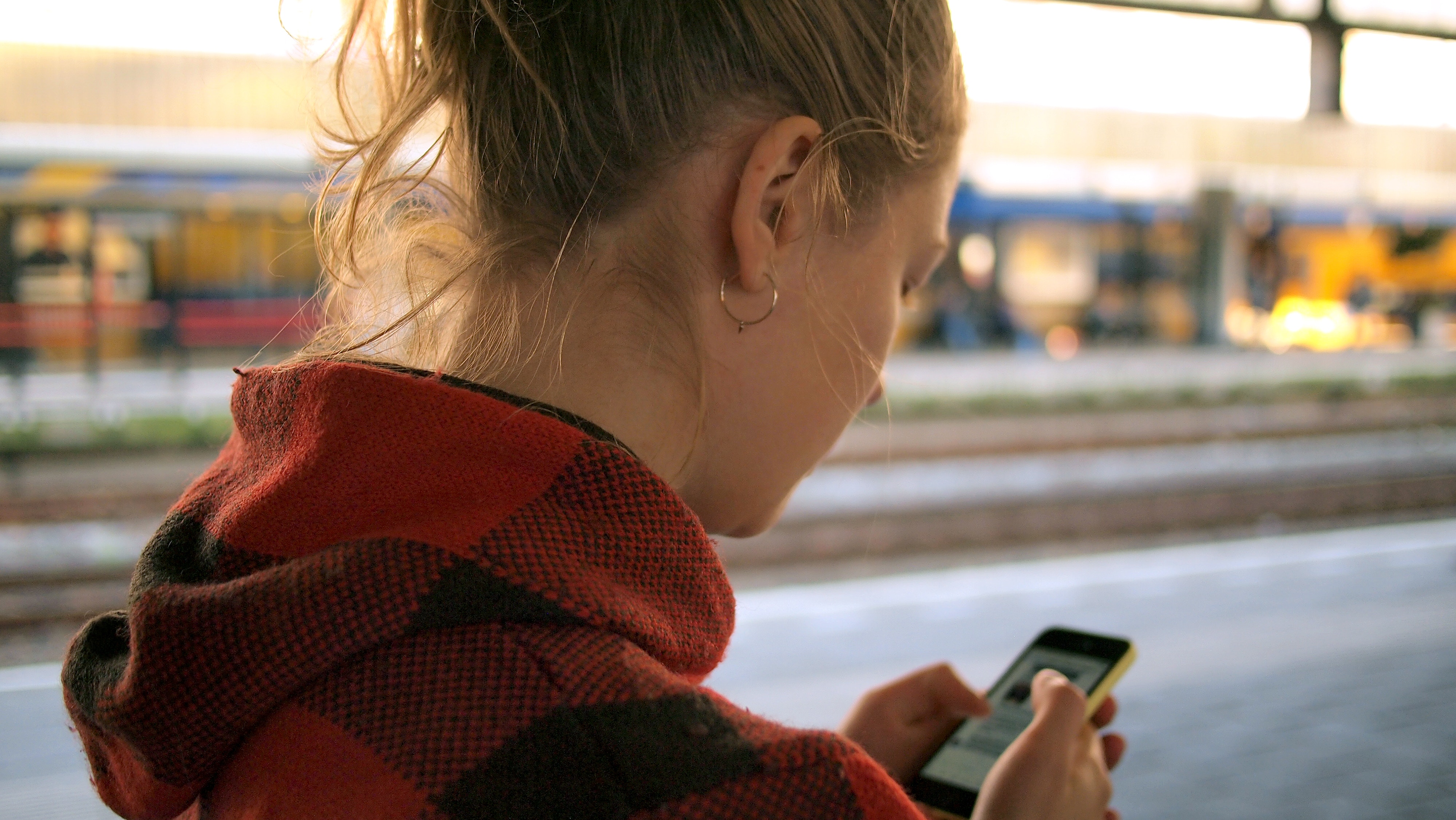 Girl using her phone on a translation
