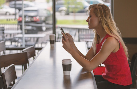 MONARCA, girl in coffee shop on her phone