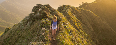 BRHP, woman walking on the top of a grassy hill