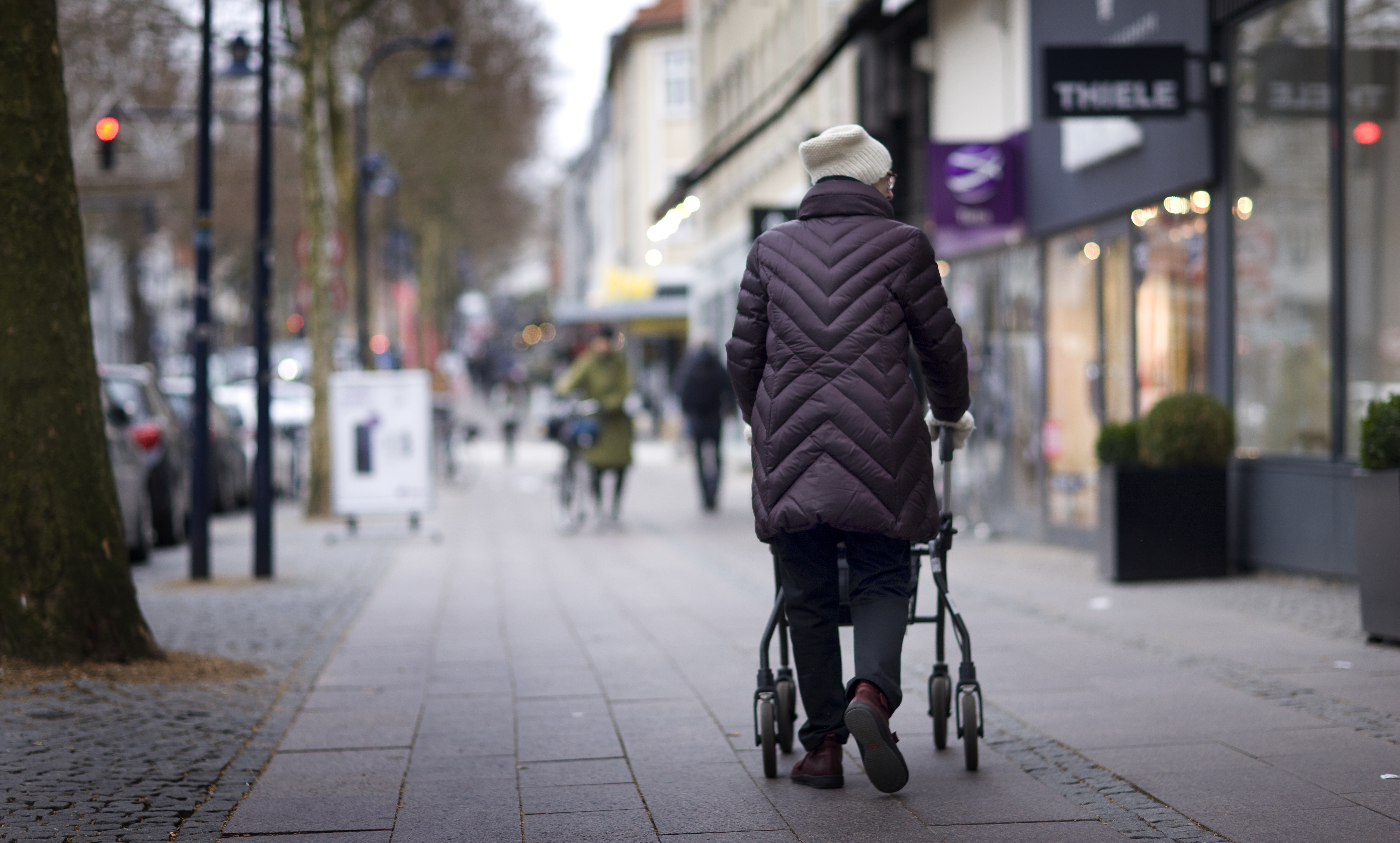 Elderly woman walking in the city