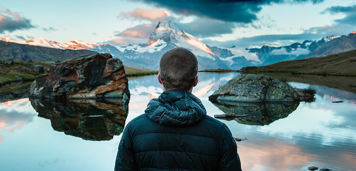 STUDIES, man looking over a lake