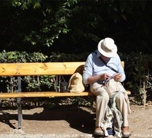 Dementia, elderly man sitting on a bench