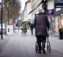 Elderly woman walking in the city