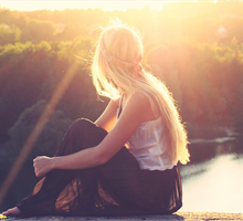 TEAM, girl sitting by a lake