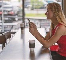 MONARCA, girl in coffee shop on her phone